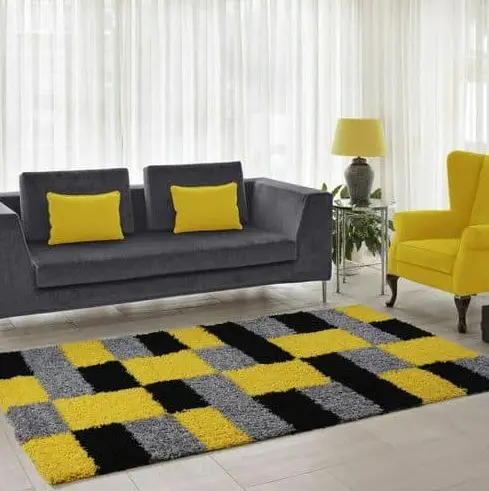 Grey sofa and yellow throw pillows